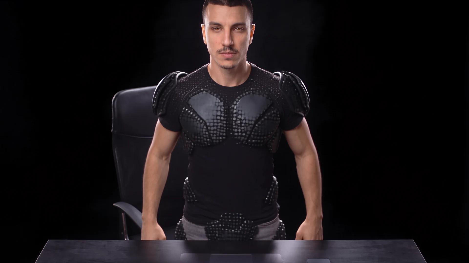 Mouncef Tamda standing as the armour forms around him.